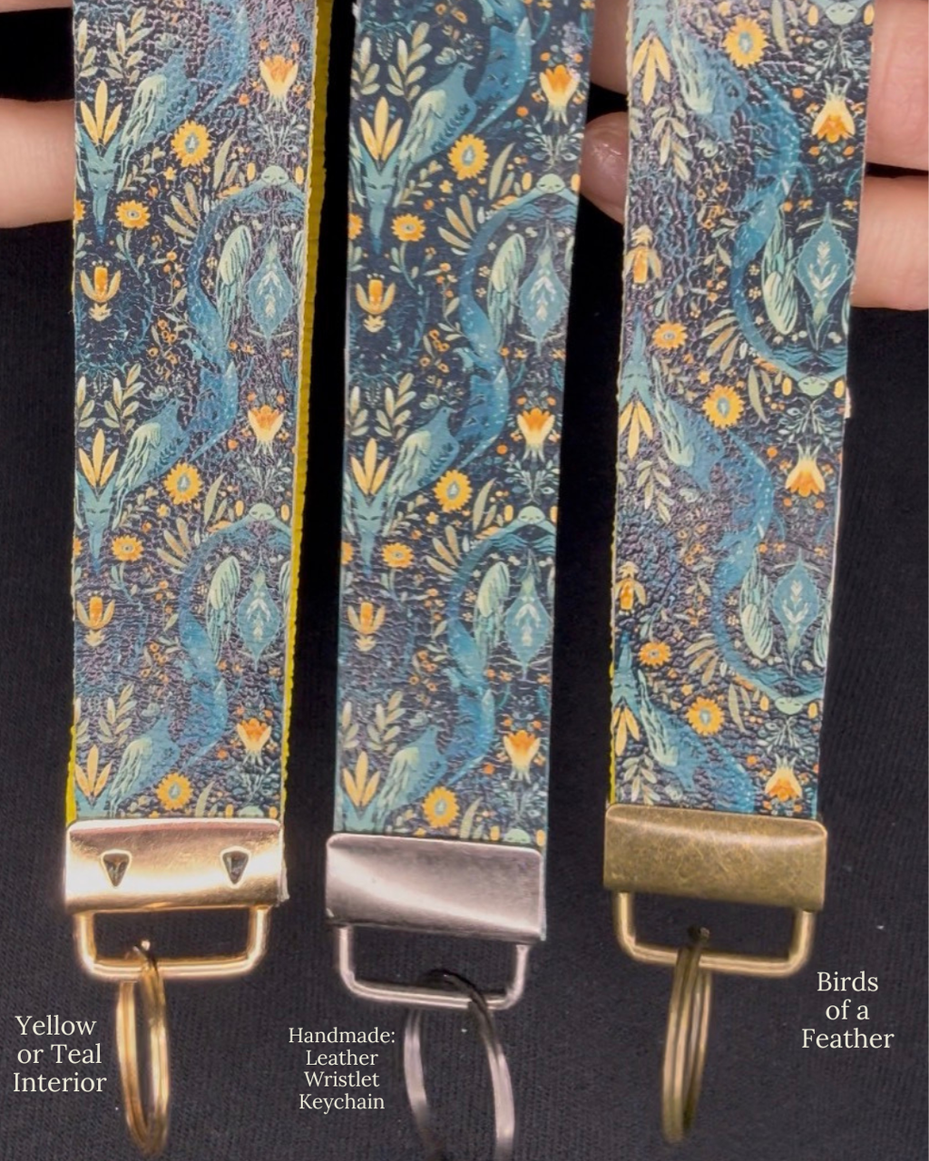 Three leather wristlets with 'Birds of a Feather' pattern held together by a black band.