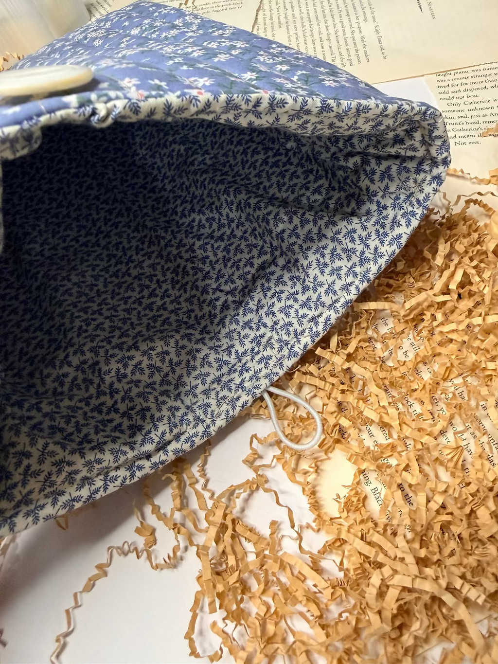 Blue patterned fabric bag on a textured surface